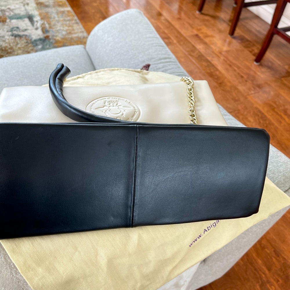 Abigail Riggs bone and black purse leather.
